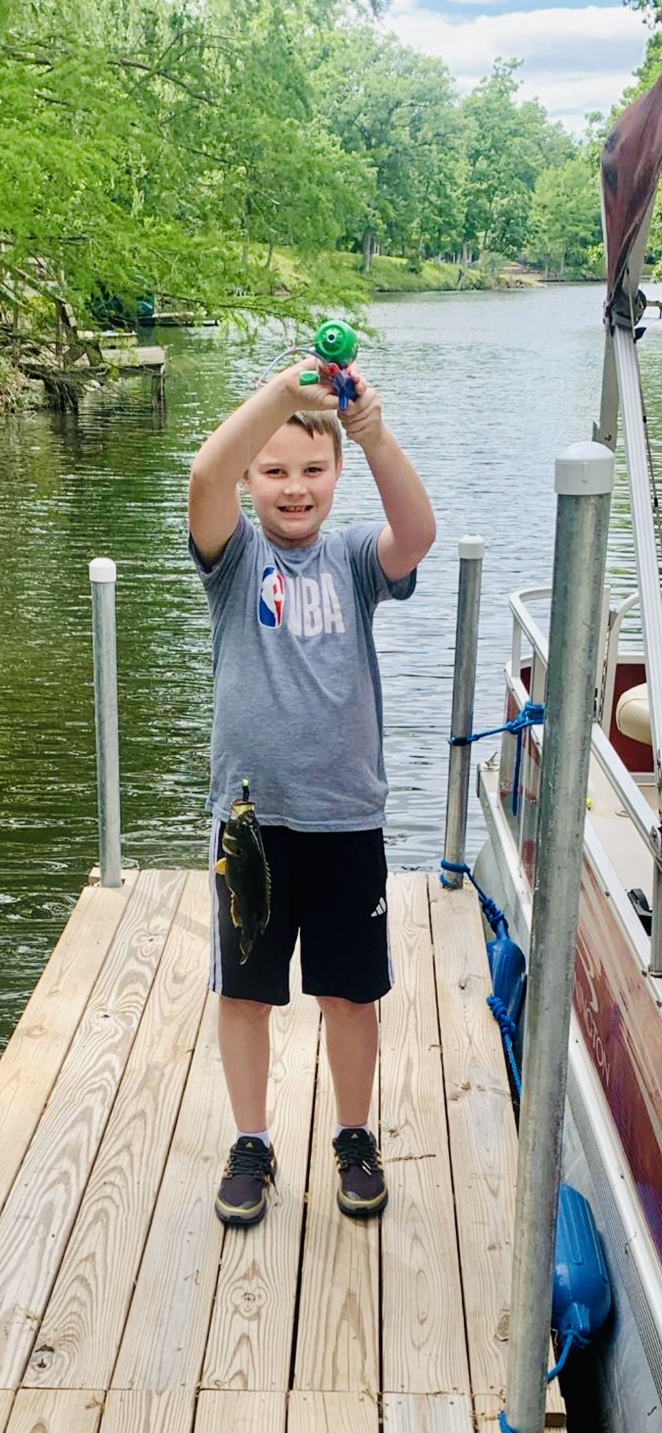 Brody’s first fish off our dock.